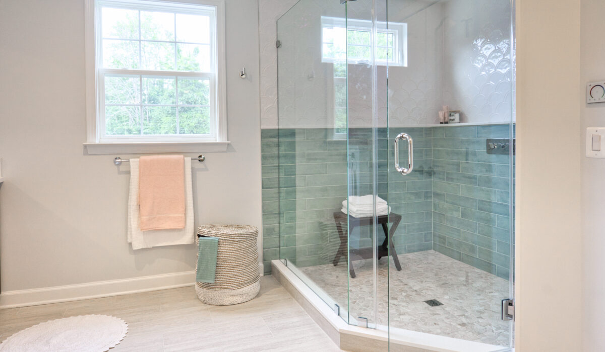 The interior of a modern bathroom with a shower box